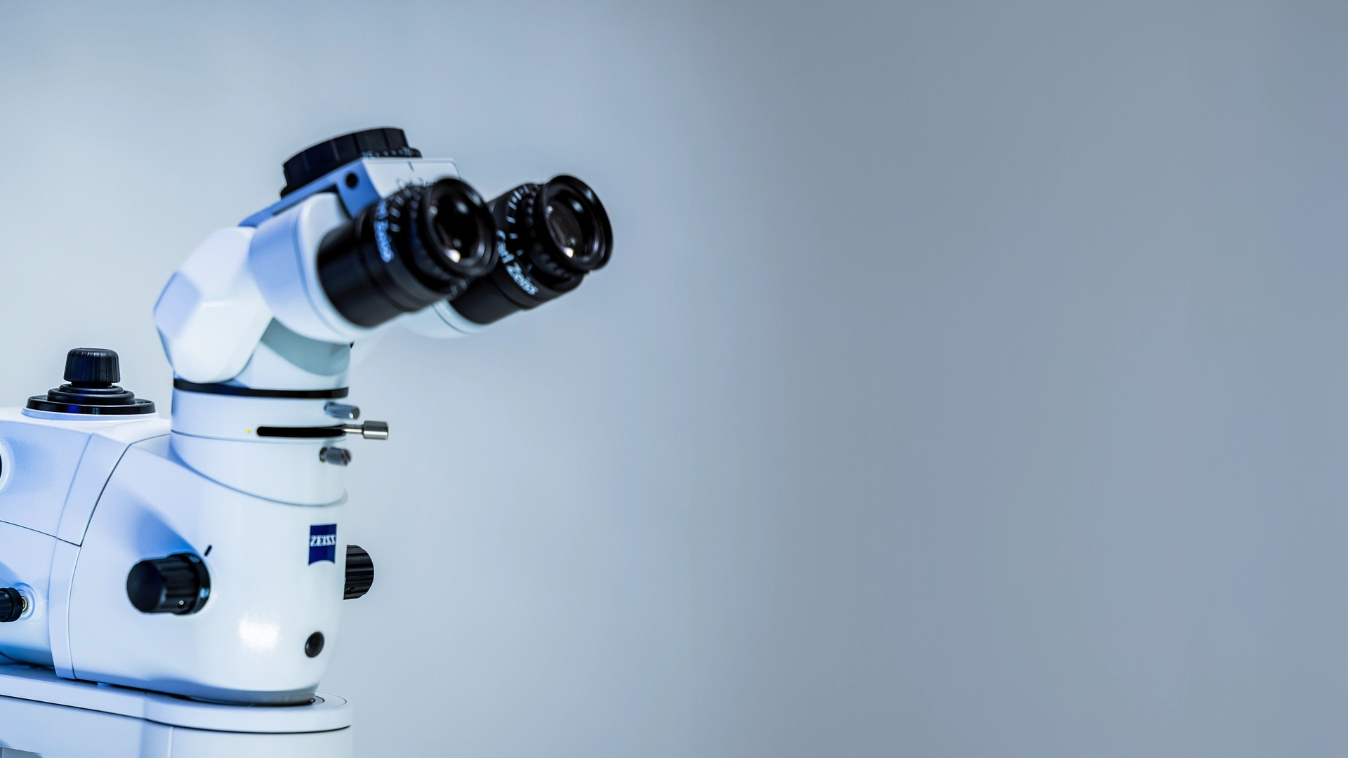 The image shows two optical telescopes with eyepieces positioned as if one were looking through them. 